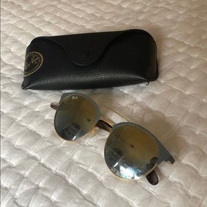 Grey raybans with yellow/black lens